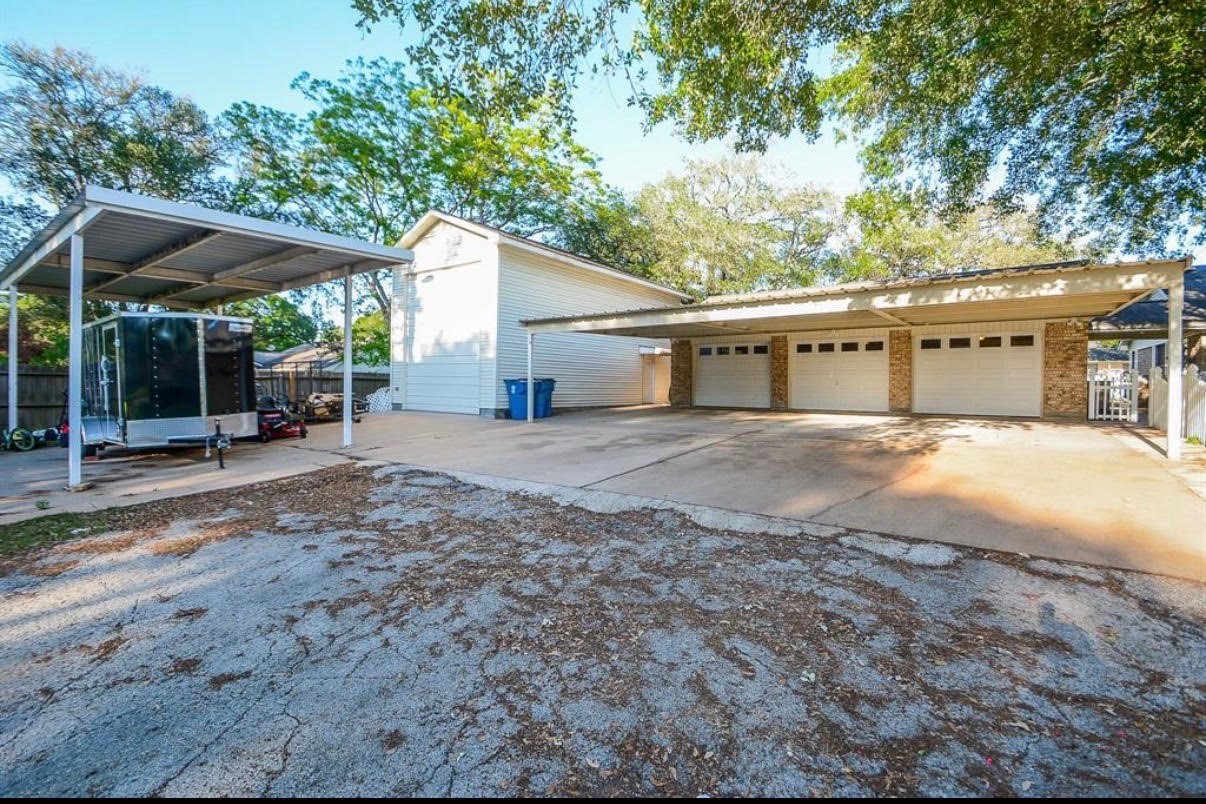 1645 9th Street Hempstead, TX 77445 - Photo 3 of 18 a view of a house with a outdoor space
