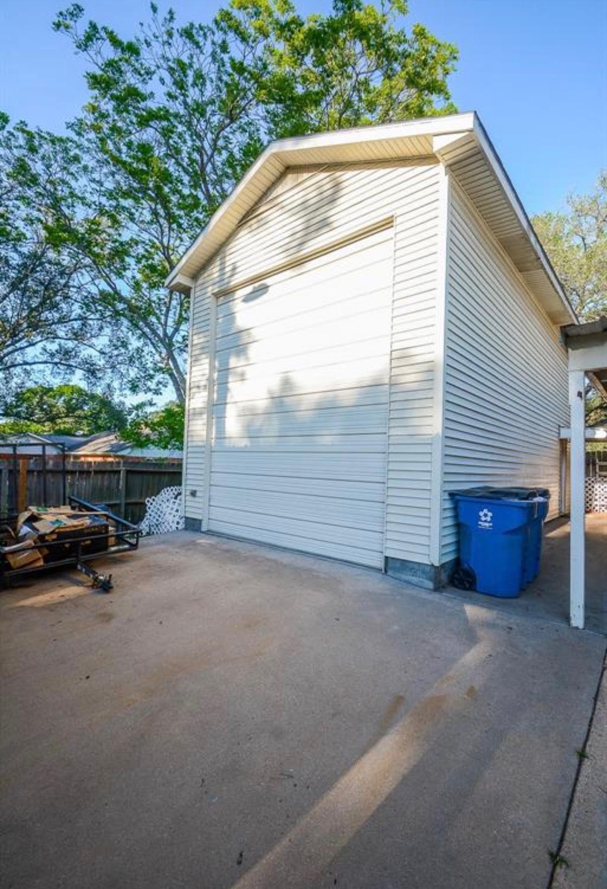 1645 9th Street Hempstead, TX 77445 - Photo 5 of 18 a view of backyard with barbeque grill and wooden fence