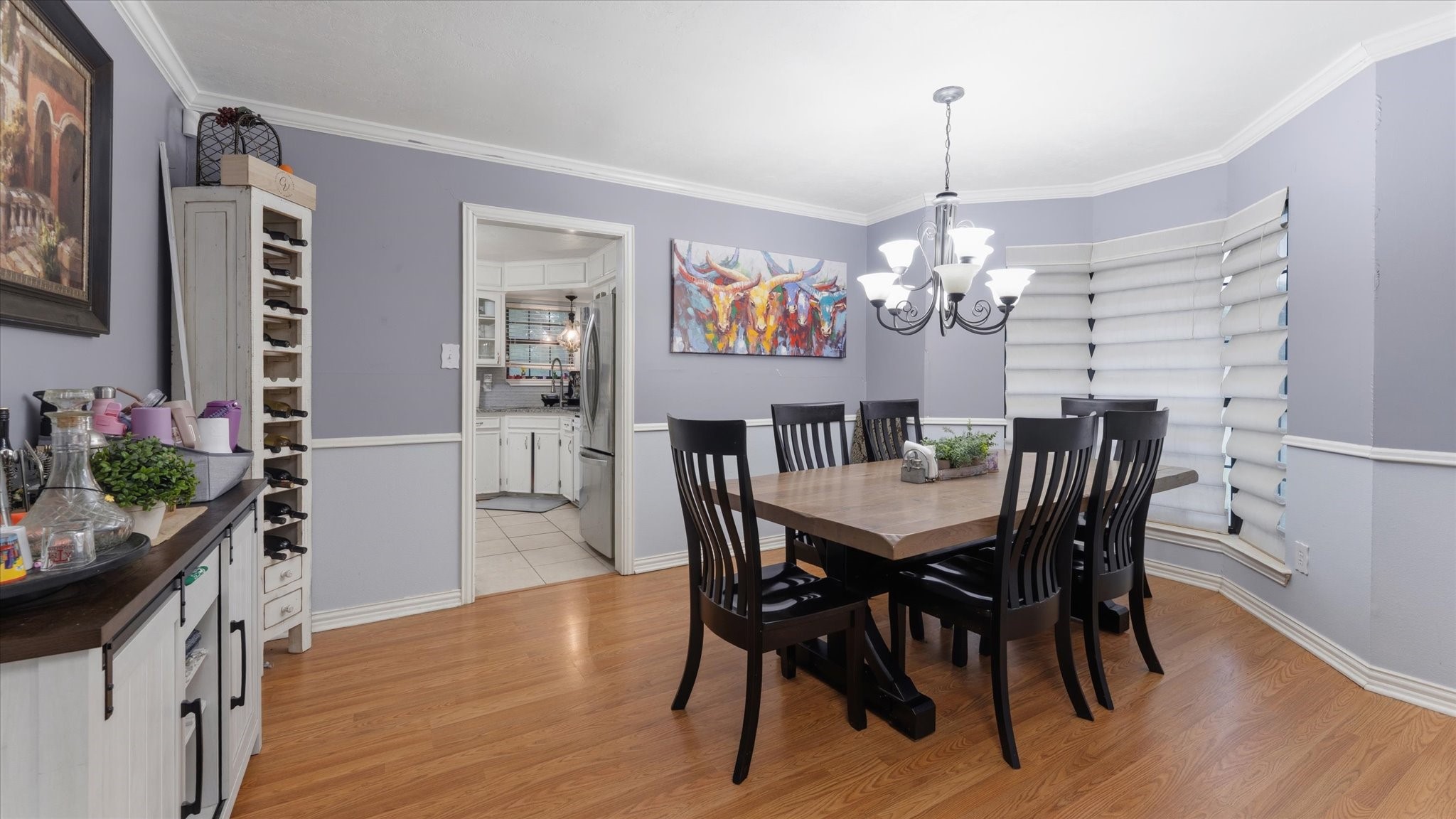 1645 9th Street Hempstead, TX 77445 - Photo 8 of 18 a dining room with furniture a chandelier and wooden floor