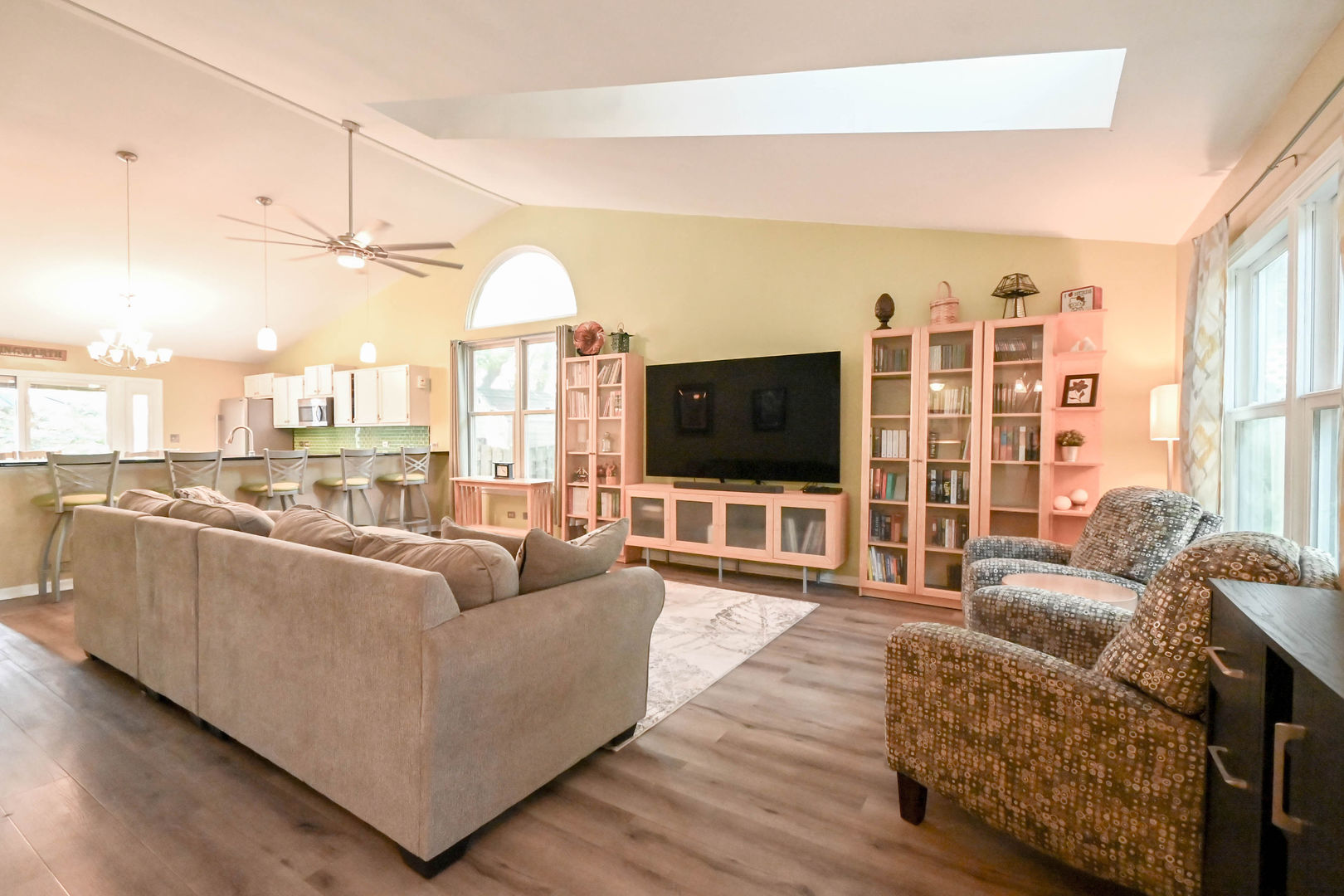 1333 Regency Lane Round Lake, IL 60073 - Photo 7 of 31 a living room with furniture a flat screen tv and a large window