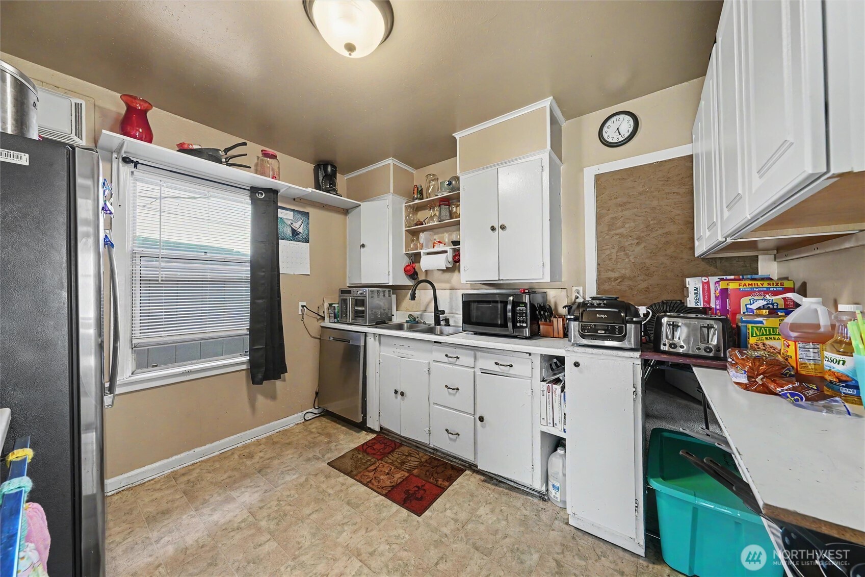 204 E Street Southwest Ephrata, WA 98823 - Photo 7 of 31 a kitchen with granite countertop a sink appliances cabinets and counter space