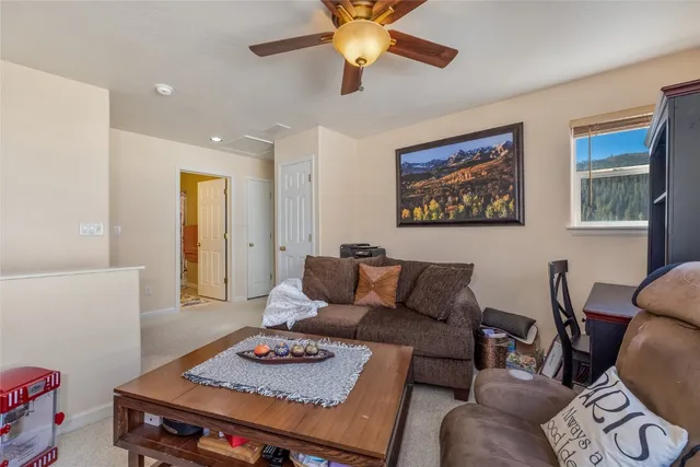 a living room with furniture and a rug