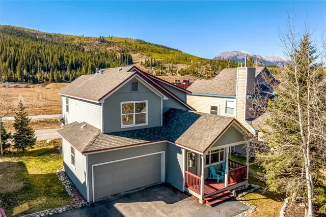 a aerial view of a house with a yard