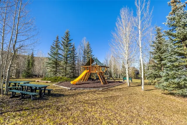 a view of outdoor space with a table and chairs