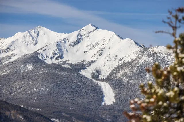 a view of snow on the side of a road