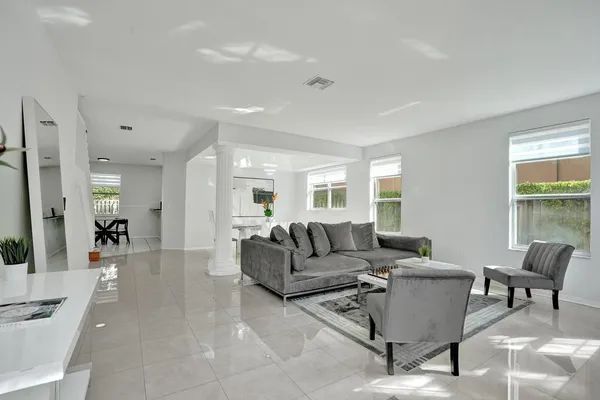a living room with furniture and a large window