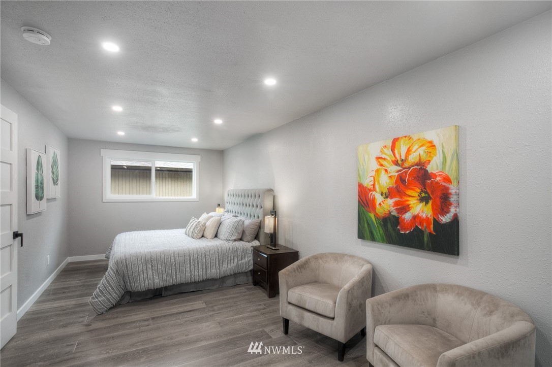 405 Maple Avenue Northwest Renton, WA 98057 - Photo 11 of 23 a bedroom with a bed and couch