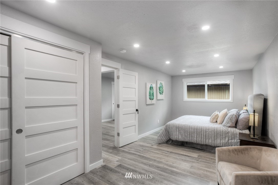 405 Maple Avenue Northwest Renton, WA 98057 - Photo 12 of 23 a bedroom with a bed and a couch