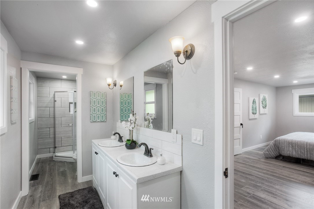 405 Maple Avenue Northwest Renton, WA 98057 - Photo 13 of 23 a bathroom with a sink a toilet and shower
