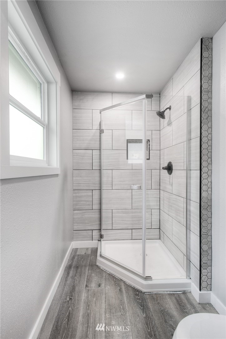 405 Maple Avenue Northwest Renton, WA 98057 - Photo 14 of 23 a bathroom with a bathtub and shower
