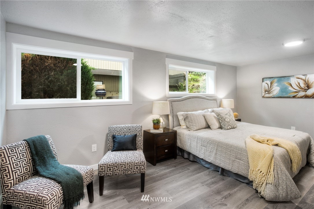 405 Maple Avenue Northwest Renton, WA 98057 - Photo 18 of 23 a bedroom with a bed and a couch