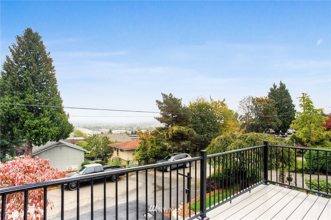 405 Maple Avenue Northwest Renton, WA 98057 - Photo 10 of 23 a view of a balcony with wooden fence and floor