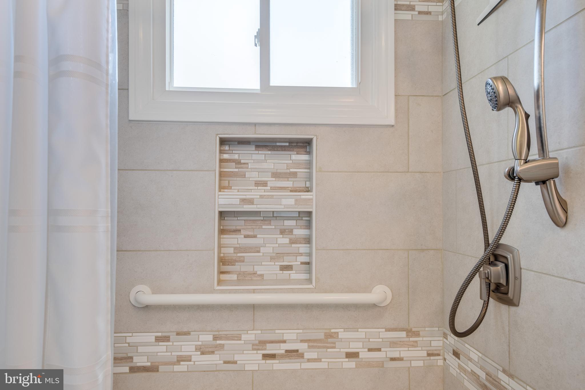 218 Atlanta Road Pasadena, MD 21122 - Photo 16 of 48 Tile work in shower and dual shower heads