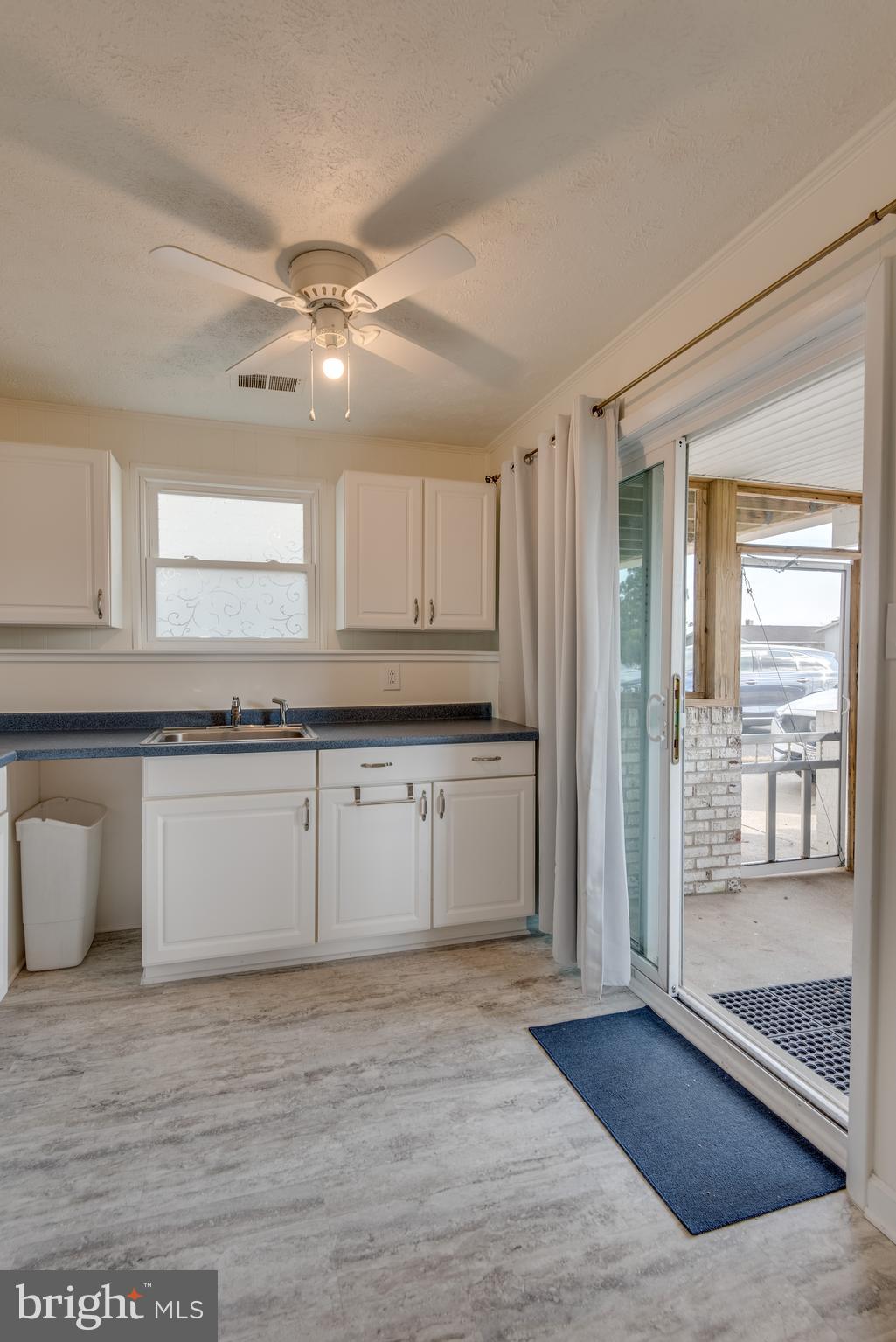 218 Atlanta Road Pasadena, MD 21122 - Photo 21 of 48 Lower level kitchenette open to screened porch