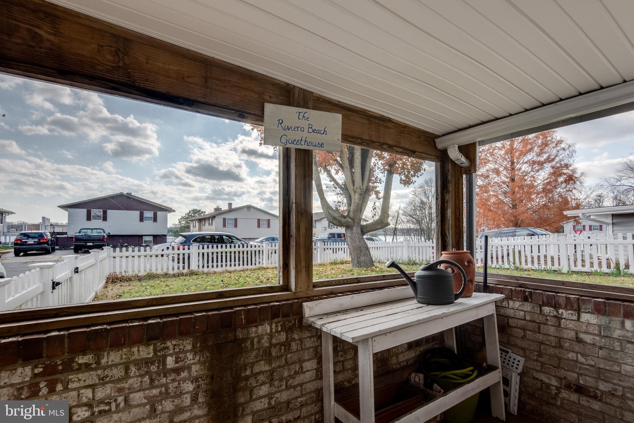 218 Atlanta Road Pasadena, MD 21122 - Photo 27 of 48 Screened porch with a view to Rock Creek