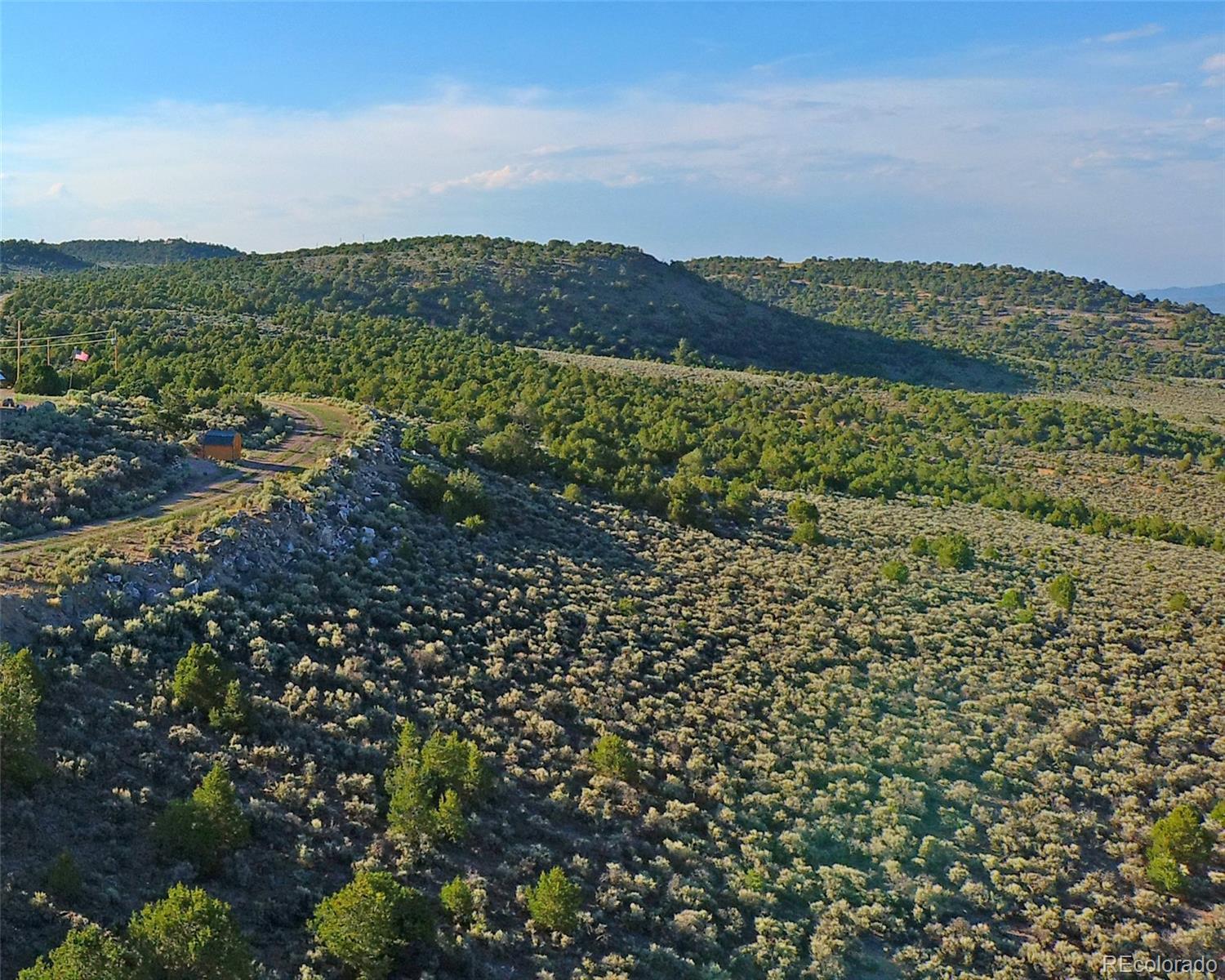 3 Melby Rancho San Luis, CO 81152 - Photo 4 of 11 a view of a lake with mountains in the background