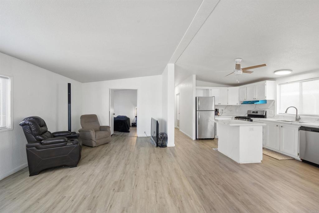 400 Greenfield Drive El Cajon, CA 92021 - Photo 11 of 41 a living room with furniture and a wooden floor