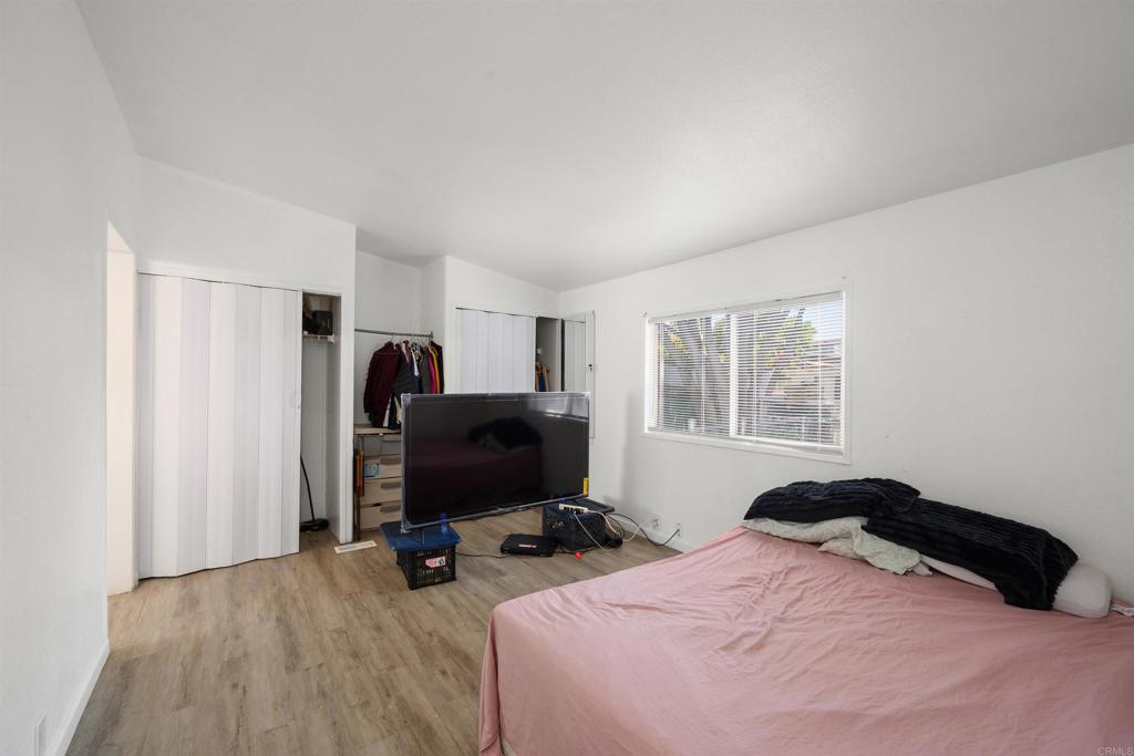 400 Greenfield Drive El Cajon, CA 92021 - Photo 20 of 41 a bedroom with a bed and a flat screen tv
