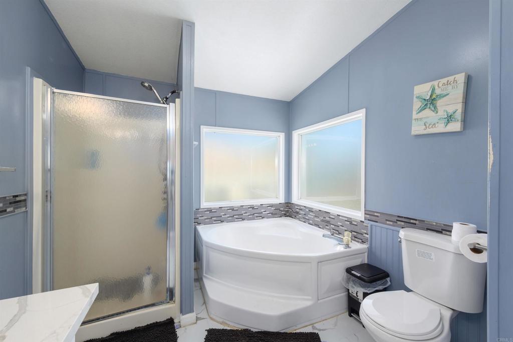 400 Greenfield Drive El Cajon, CA 92021 - Photo 23 of 41 a bathroom with a toilet a sink and shower