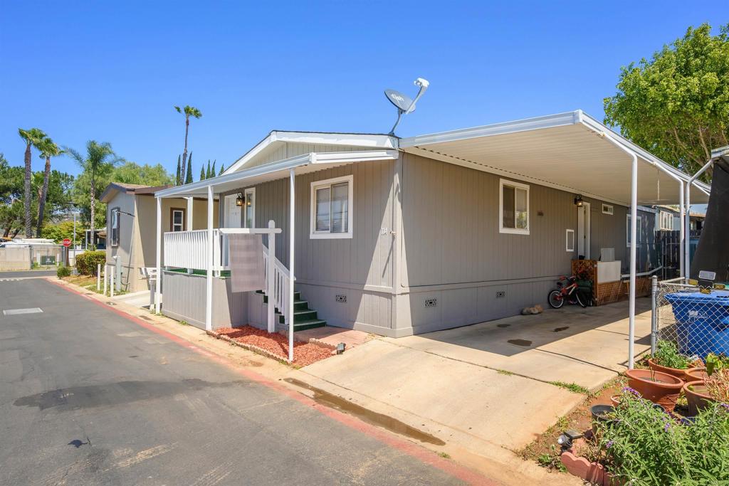 400 Greenfield Drive El Cajon, CA 92021 - Photo 3 of 41 a front view of a house with a porch