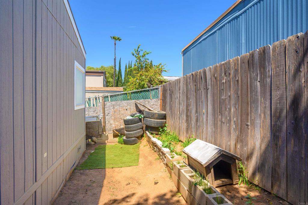 400 Greenfield Drive El Cajon, CA 92021 - Photo 32 of 41 a balcony with chairs and a potted plant
