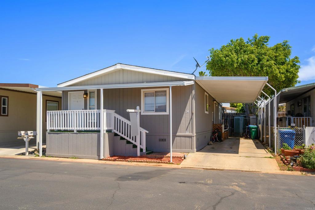 400 Greenfield Drive El Cajon, CA 92021 - Photo 4 of 41 a front view of a house with a garage