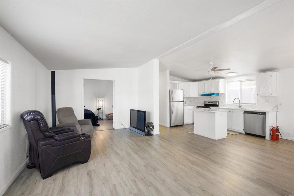 400 Greenfield Drive El Cajon, CA 92021 - Photo 9 of 41 a living room with furniture and kitchen view