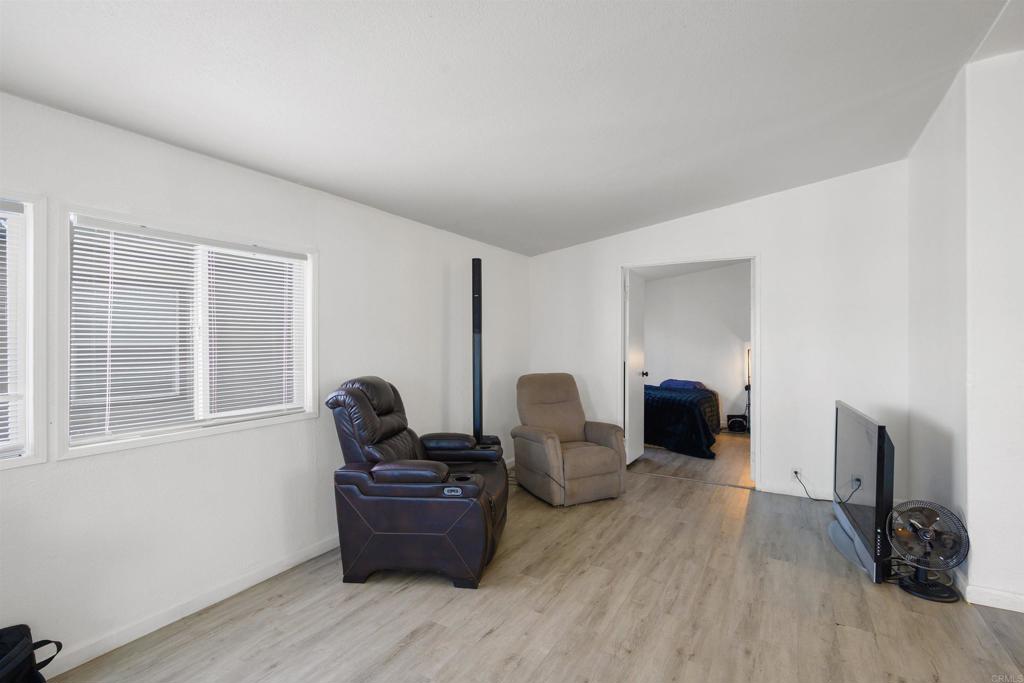 400 Greenfield Drive El Cajon, CA 92021 - Photo 10 of 41 a living room with furniture windows and a fireplace