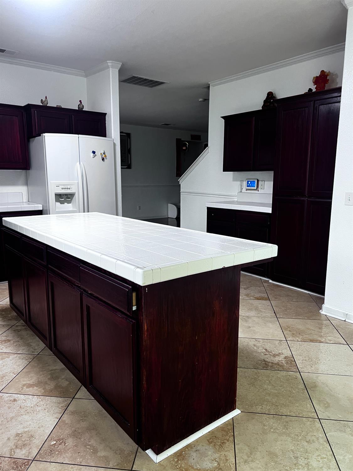 1950 West Rio Hondo Way Hanford, CA 93230 - Photo 11 of 56 a kitchen with stainless steel appliances a refrigerator and a stove