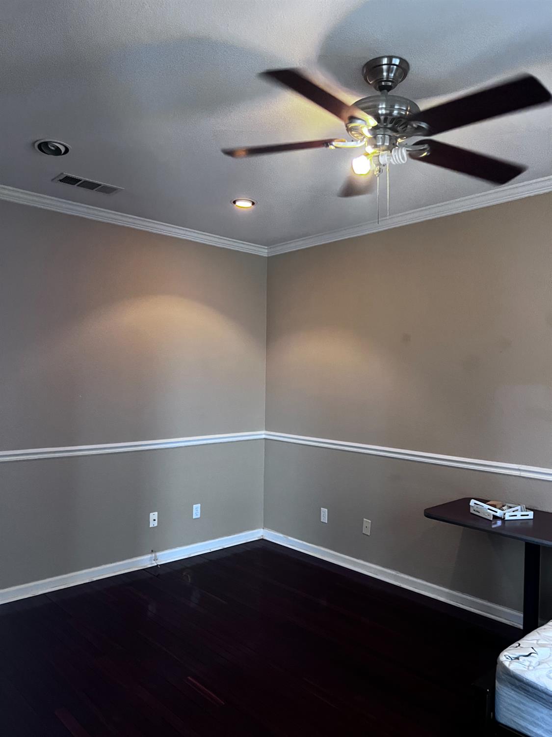 1950 West Rio Hondo Way Hanford, CA 93230 - Photo 5 of 56 an empty room with wooden floor and chandelier fan