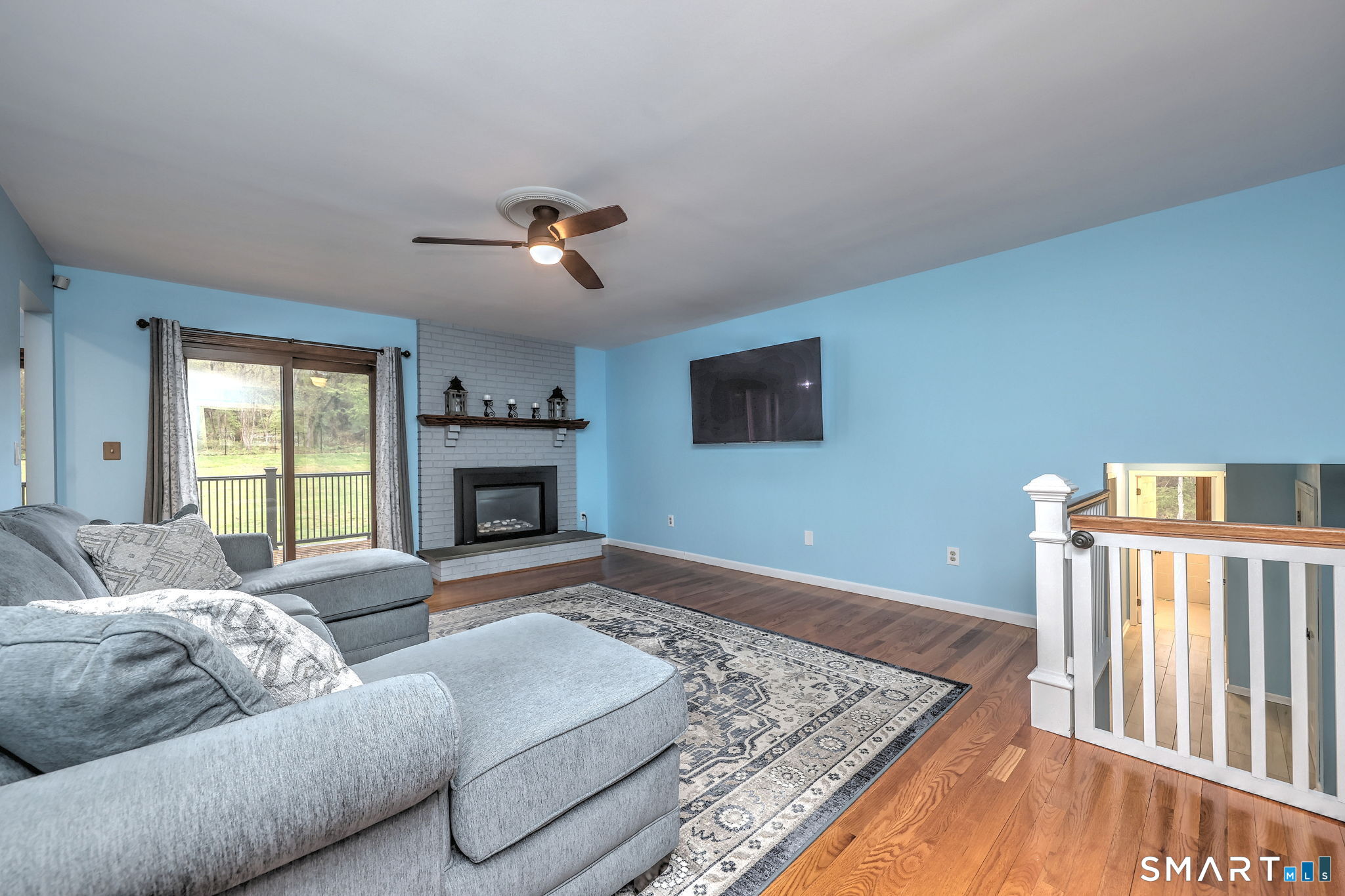 2262 Ridge Road North Haven, CT 06473 - Photo 31 of 40 a living room with furniture fireplace and flat screen tv