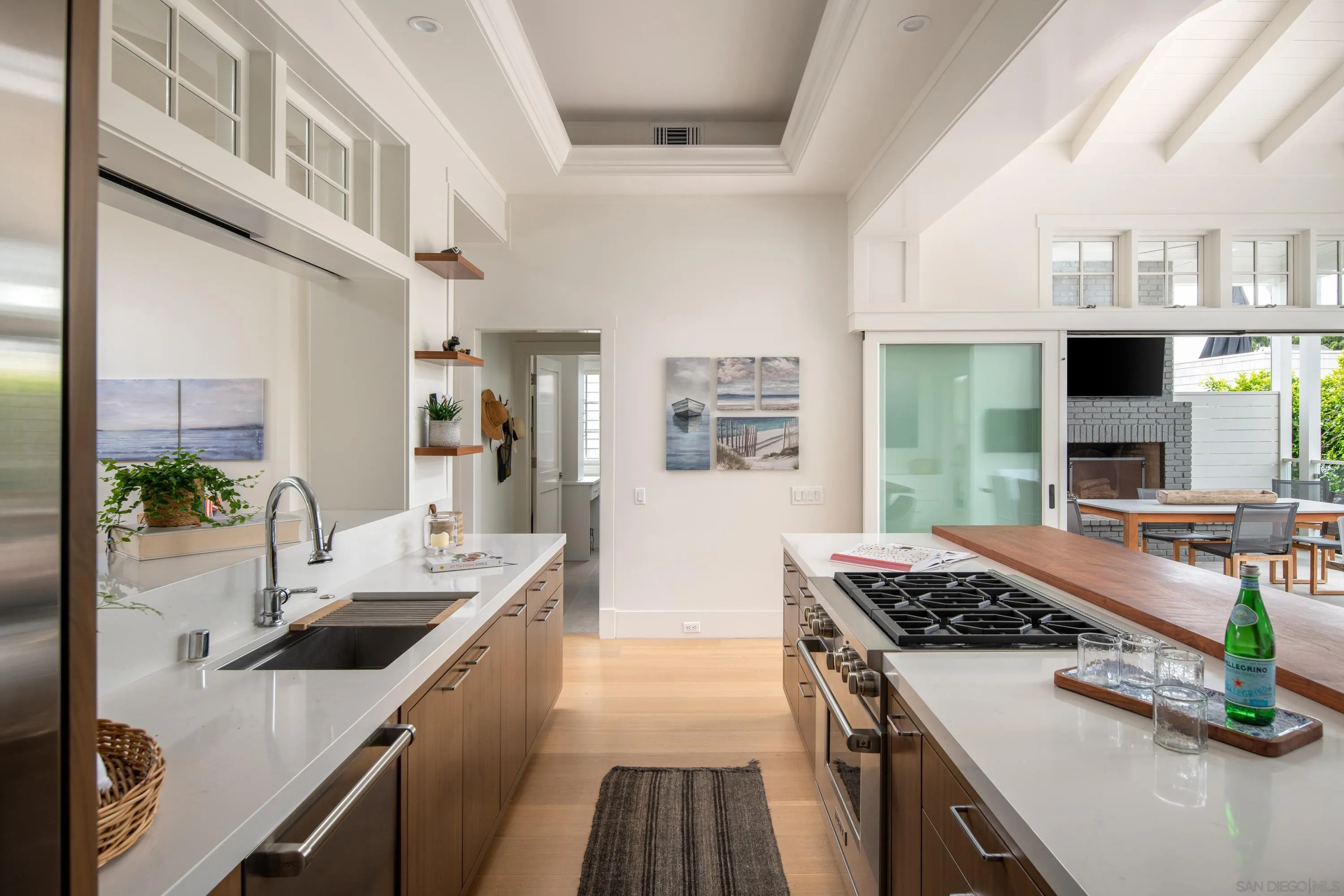 236 24th Street Del Mar, CA 92014 - Photo 14 of 34 a kitchen with kitchen island granite countertop a sink stove and cabinets