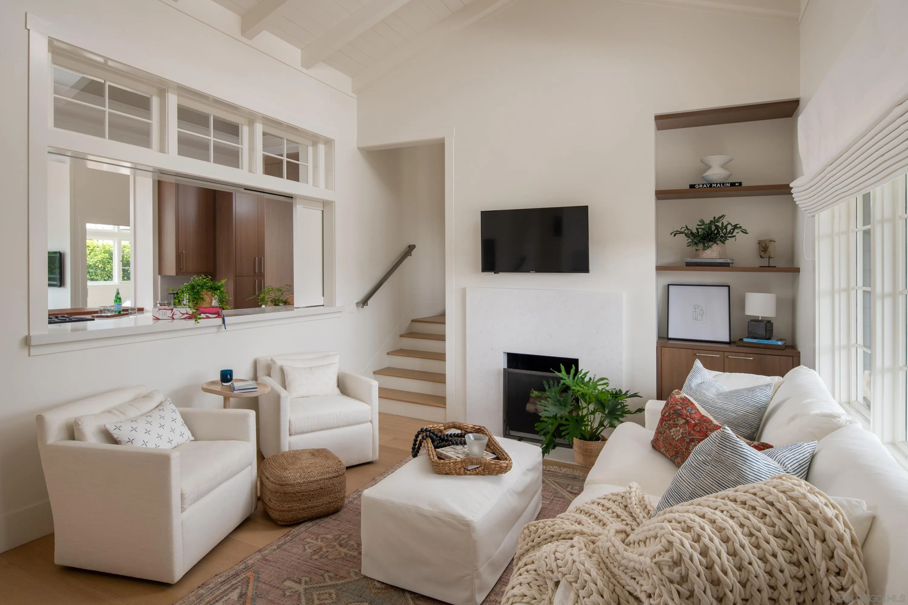 236 24th Street Del Mar, CA 92014 - Photo 15 of 34 a living room with furniture a fireplace and a flat screen tv