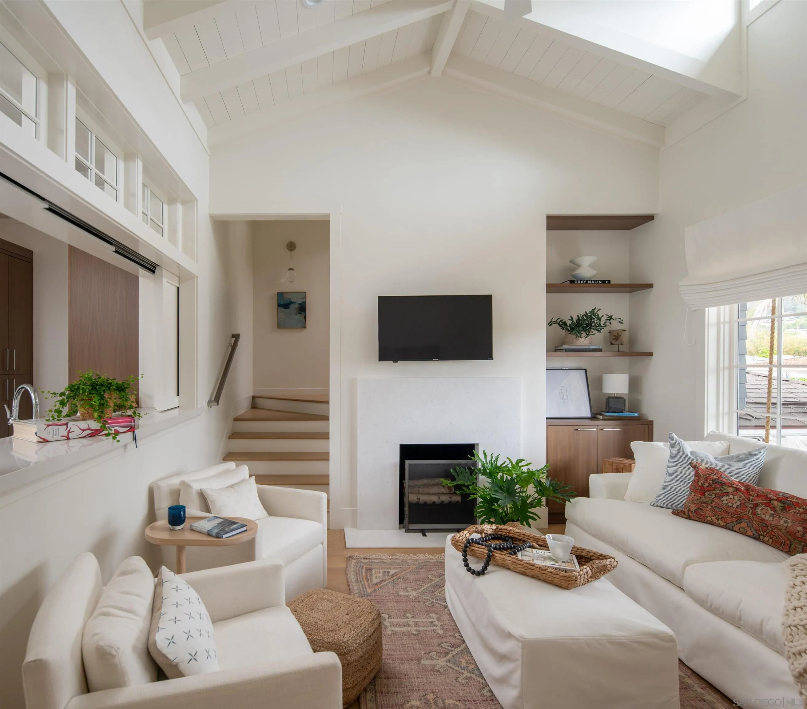 236 24th Street Del Mar, CA 92014 - Photo 16 of 34 a living room with furniture a fireplace and a flat screen tv