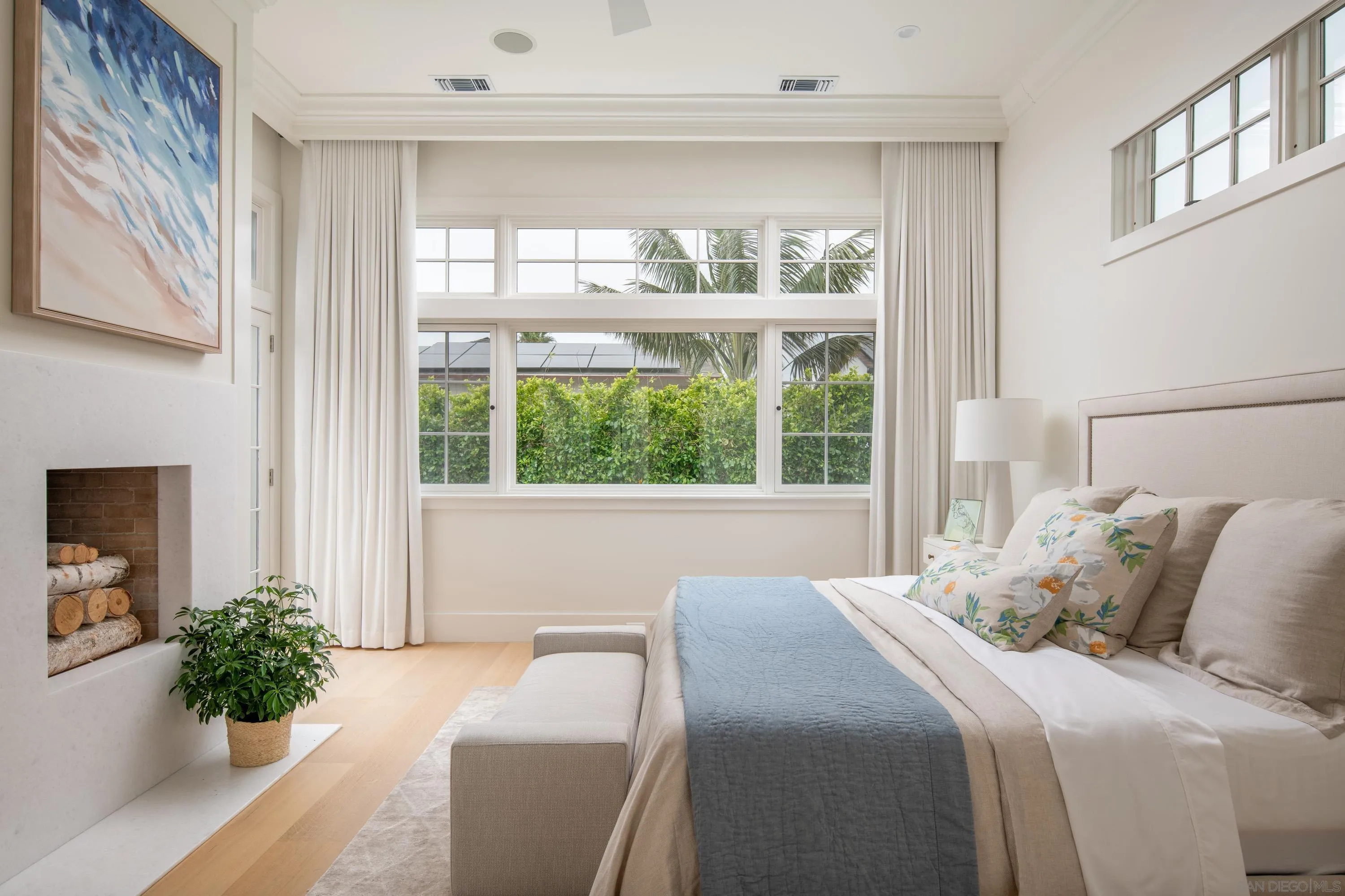 236 24th Street Del Mar, CA 92014 - Photo 18 of 34 a bedroom with a large bed and a potted plant