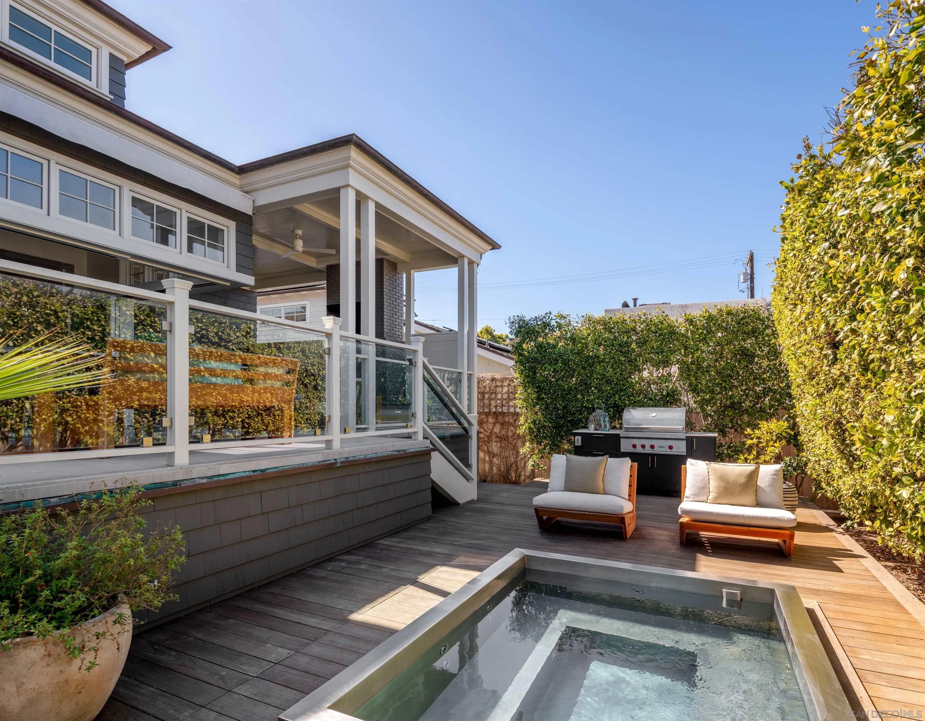 236 24th Street Del Mar, CA 92014 - Photo 6 of 34 a view of a patio with couches table and chairs and potted plants