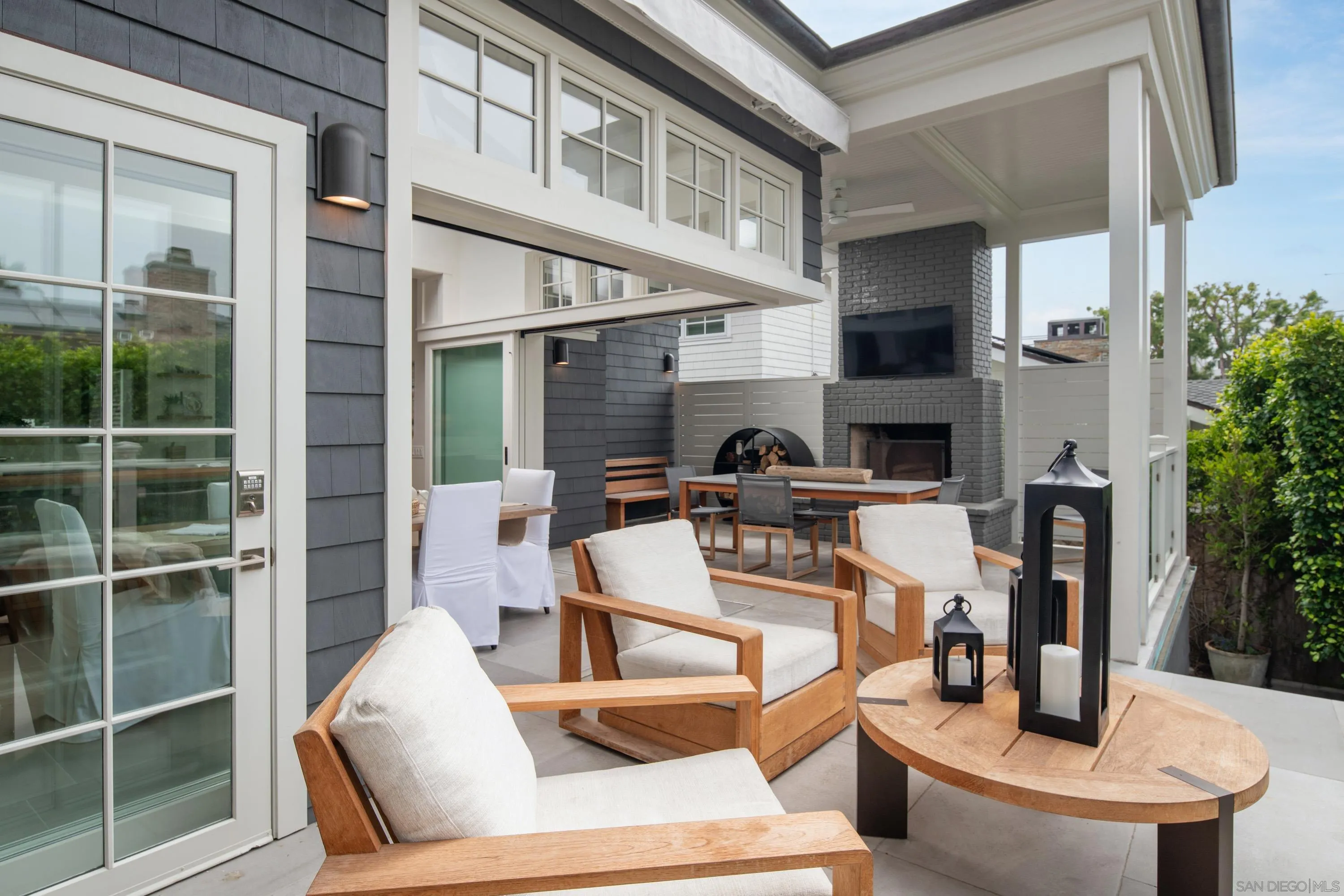 236 24th Street Del Mar, CA 92014 - Photo 7 of 34 a view of a patio with table and chairs and potted plants