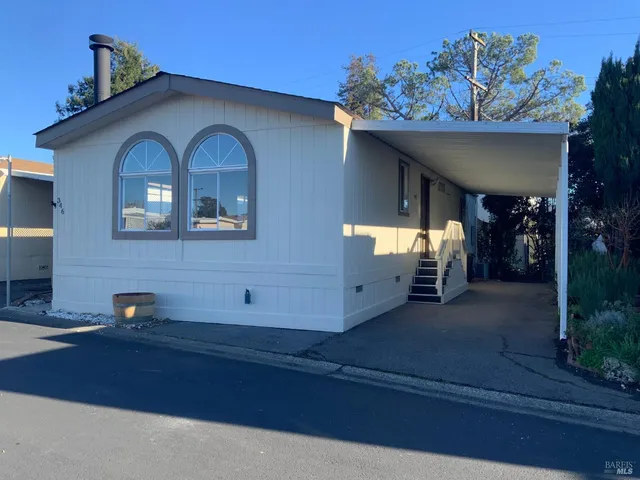a front view of a house with parking