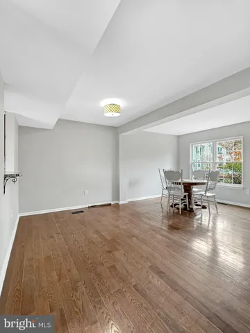 a view of dining room with furniture and wooden floor