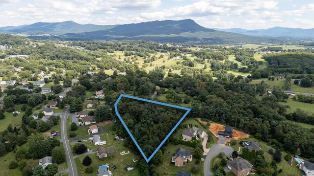 an aerial view of a town with couple of houses