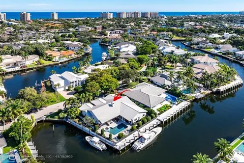 an aerial view of a house with a lake view