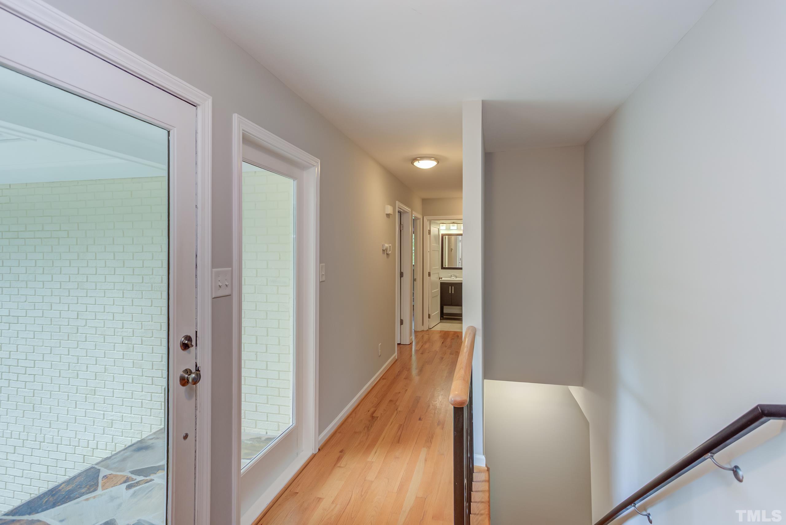 912 Winona Road Raleigh, NC 27609 - Photo 2 of 30 a view of a hallway with wooden floor