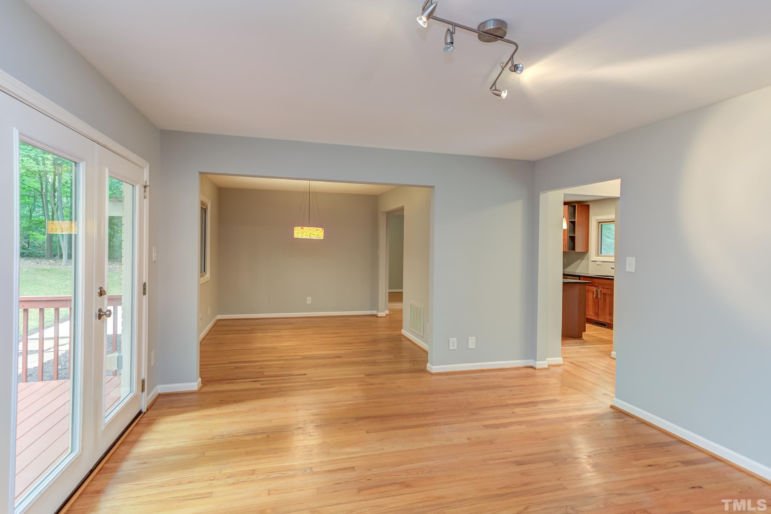 912 Winona Road Raleigh, NC 27609 - Photo 11 of 30 a view of empty room with wooden floor