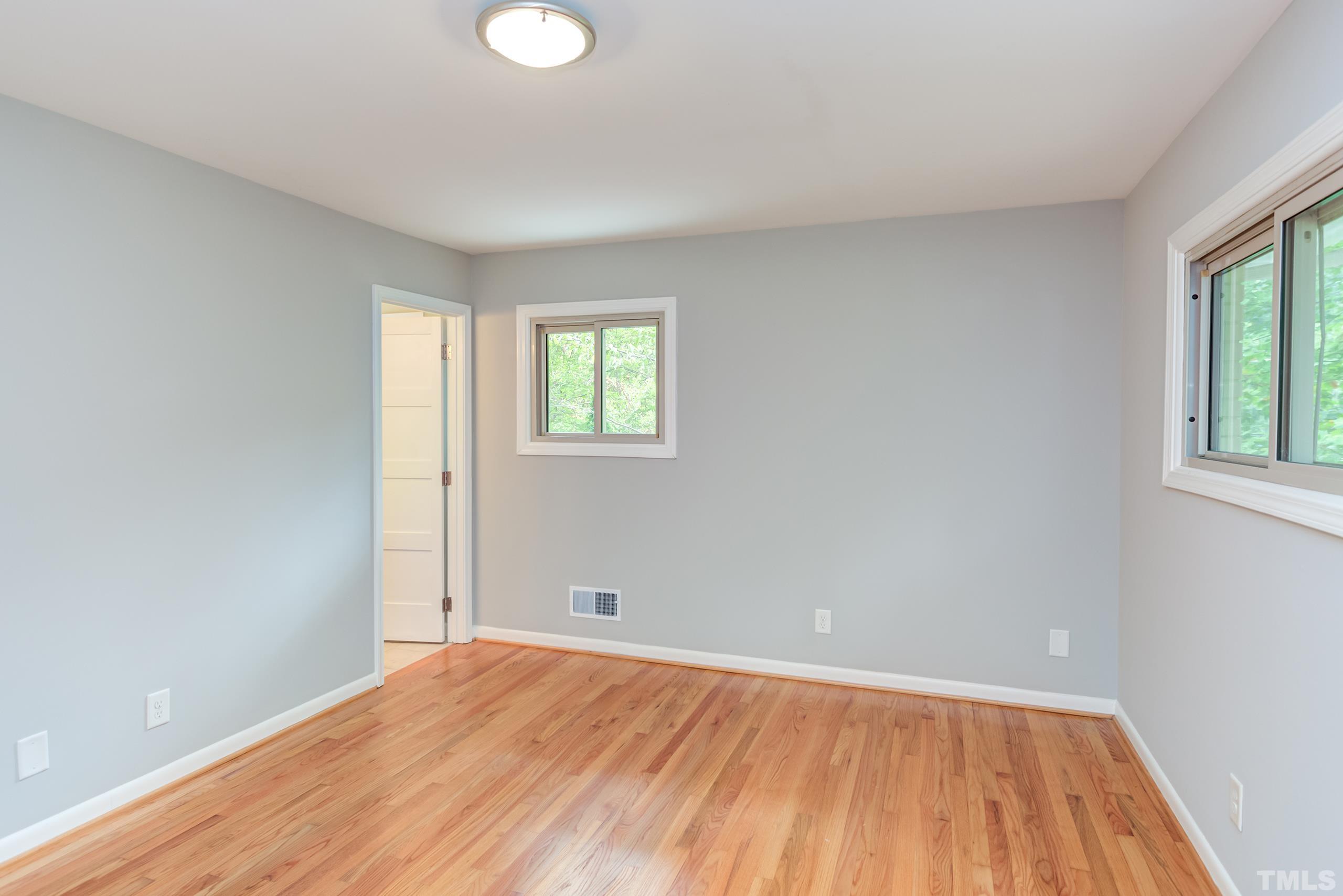 912 Winona Road Raleigh, NC 27609 - Photo 20 of 30 wooden floor in an empty room with a window