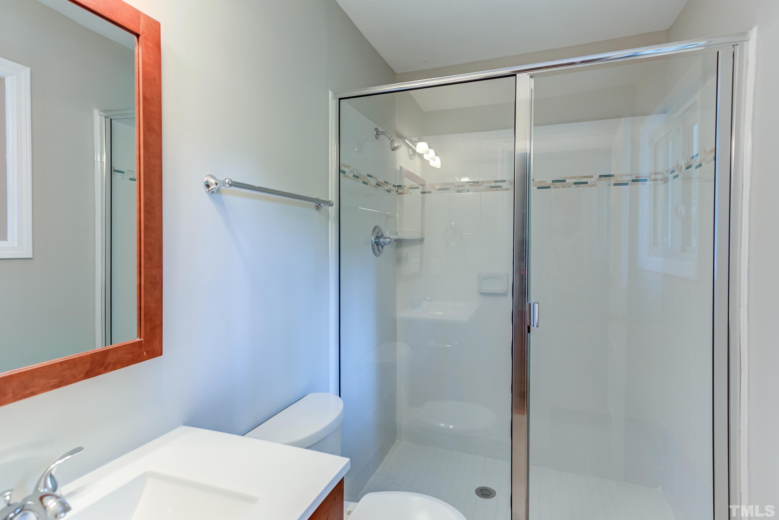 912 Winona Road Raleigh, NC 27609 - Photo 23 of 30 a bathroom with a shower a toilet and a sink