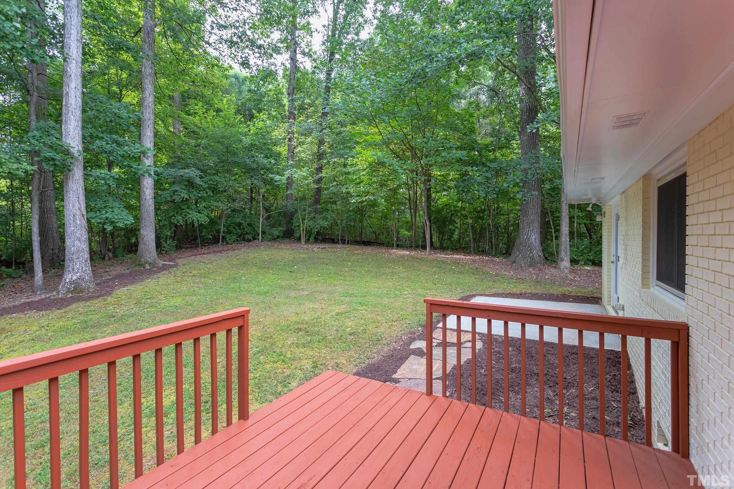 912 Winona Road Raleigh, NC 27609 - Photo 28 of 30 a view of a wooden deck with a yard