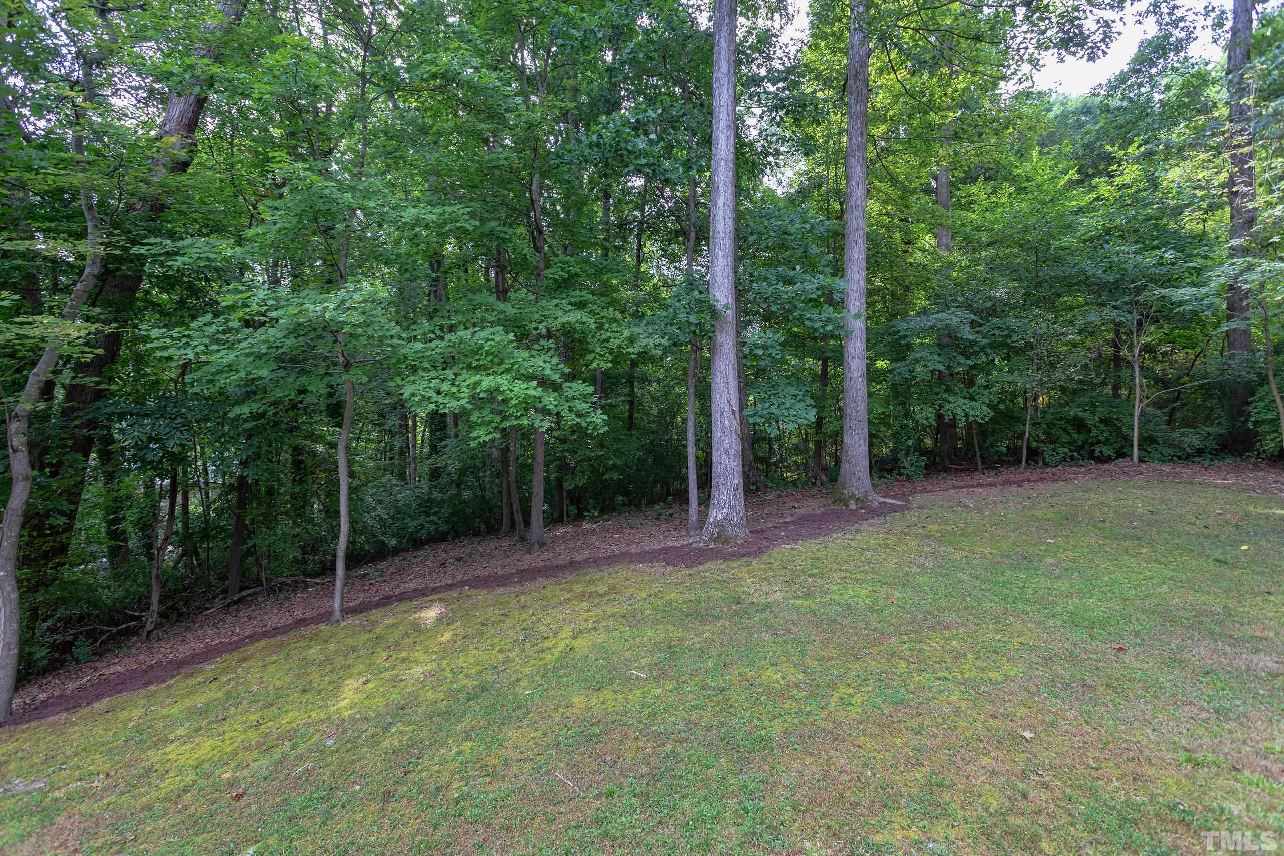 912 Winona Road Raleigh, NC 27609 - Photo 29 of 30 a view of a field with trees in the background