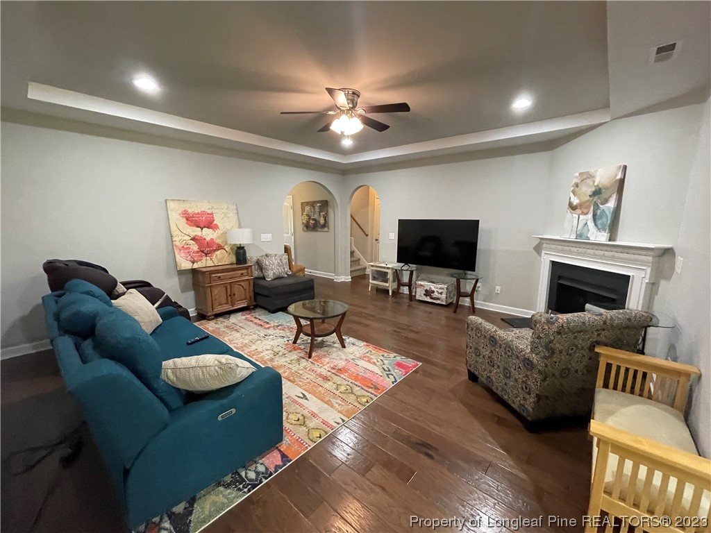 6298 Phillipi Church Road Raeford, NC 28376 - Photo 12 of 31 a living room with furniture a flat screen tv and a fireplace