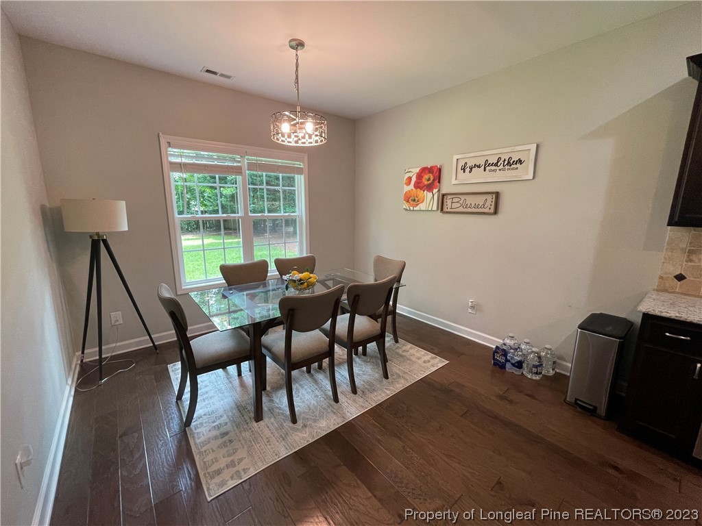 6298 Phillipi Church Road Raeford, NC 28376 - Photo 14 of 31 a view of a dining room with furniture window and outside view