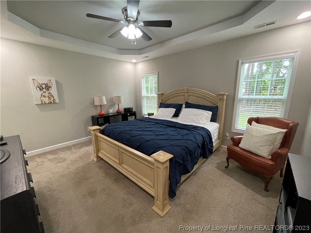 6298 Phillipi Church Road Raeford, NC 28376 - Photo 19 of 31 a spacious bedroom with a bed and window